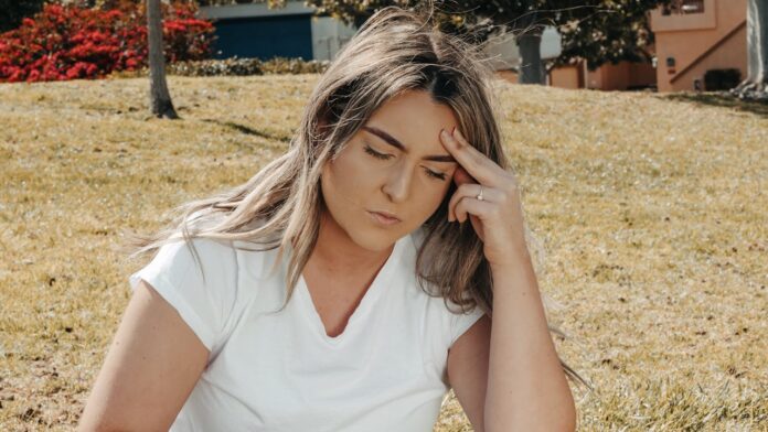 Photo by Kindel Media: https://www.pexels.com/photo/a-woman-touching-her-head-7298393/
