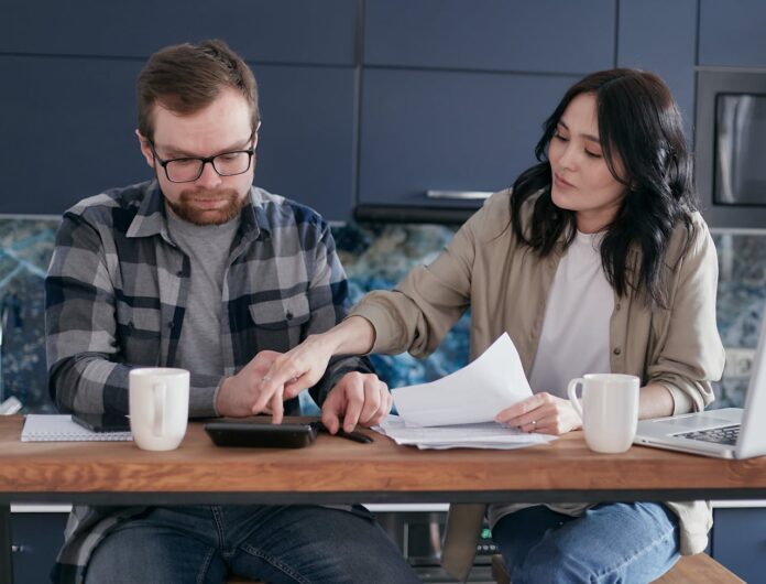 Photo by Mikhail Nilov: https://www.pexels.com/photo/couple-people-woman-desk-6963038/