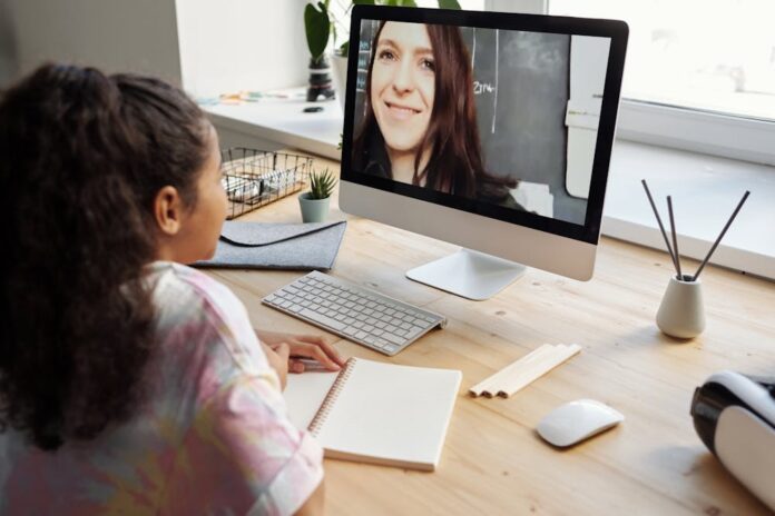 Photo by Julia M Cameron: https://www.pexels.com/photo/girl-in-pink-and-white-shirt-sitting-beside-brown-wooden-table-4143795/