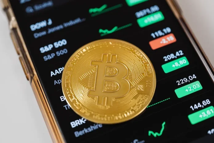 Photo by Photo By: Kaboompics.com: https://www.pexels.com/photo/gold-round-coin-on-top-of-a-cellphone-5980856/