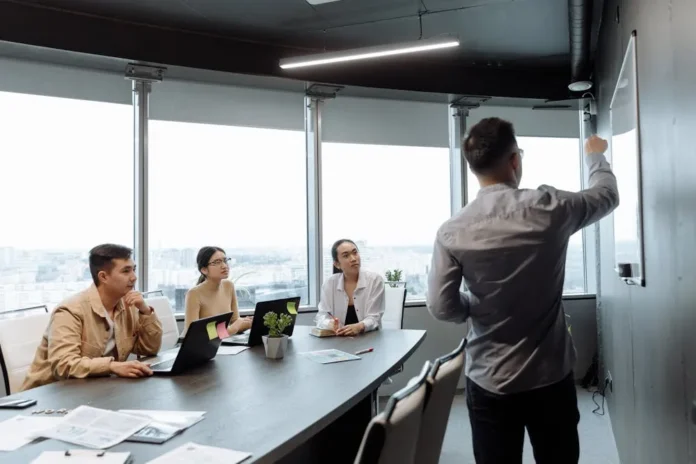 Photo by Thirdman : https://www.pexels.com/photo/photo-of-a-man-presenting-at-a-meeting-7654000/